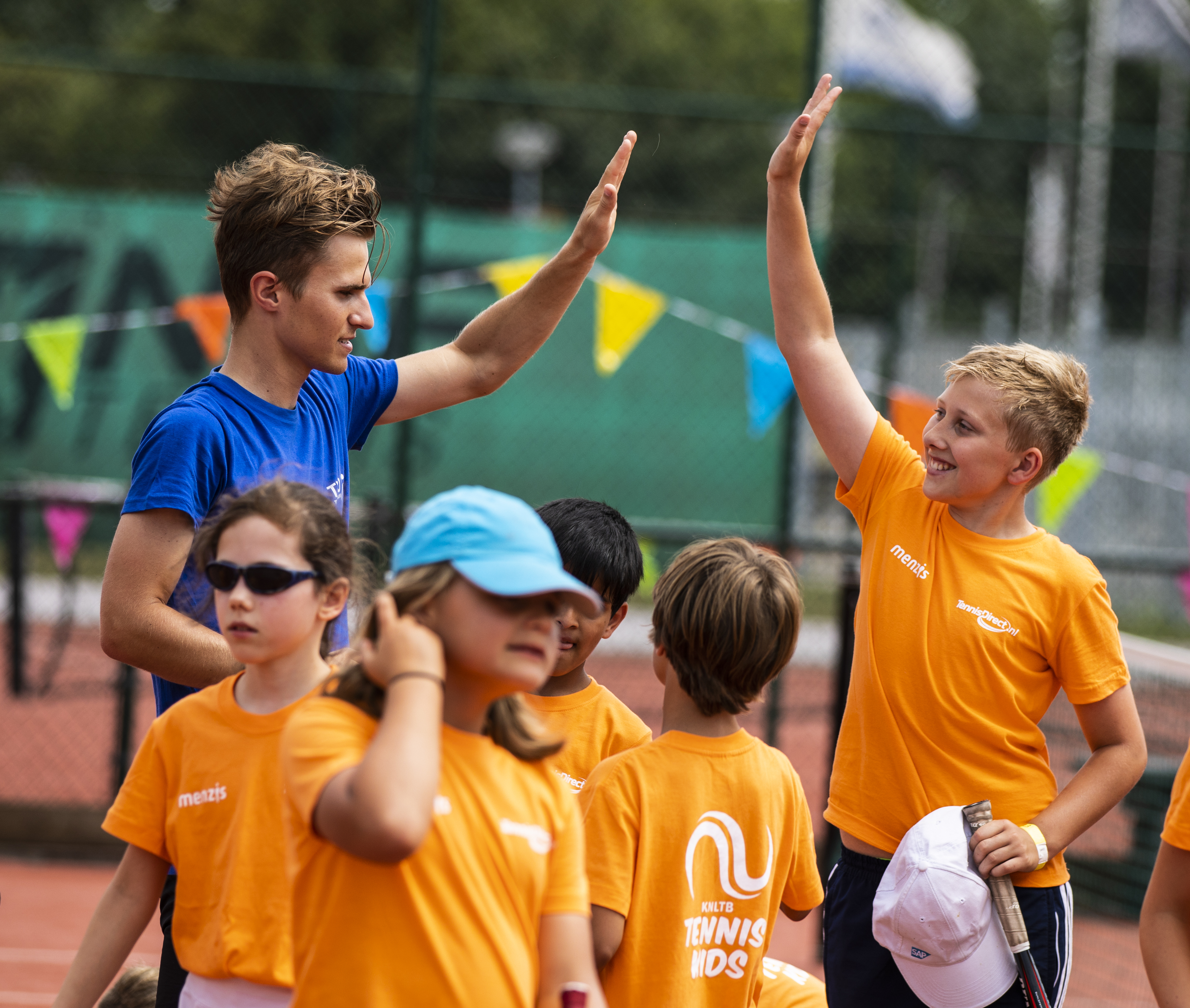 Tennis kids high five